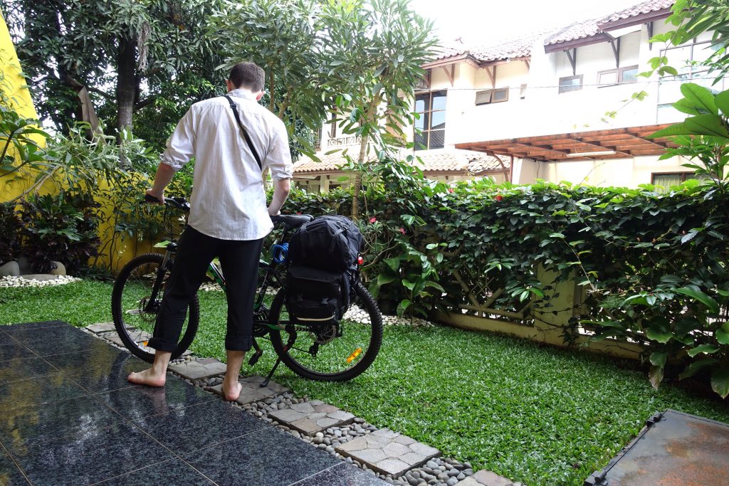 Author looking at loaded touring bike